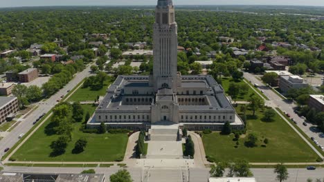 pan up reveals nebraska state capitol on beautiful summer day