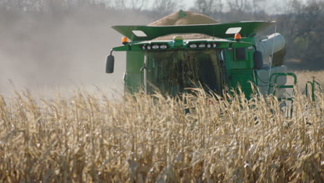 combine harvester, sunny day, slow motion