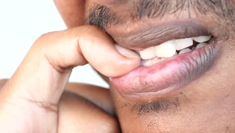 man biting his nails