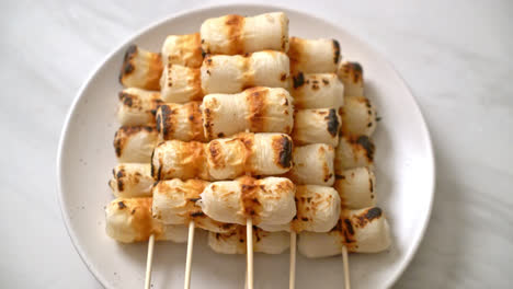 grilled tube shaped fish paste cake or tube squid skewer