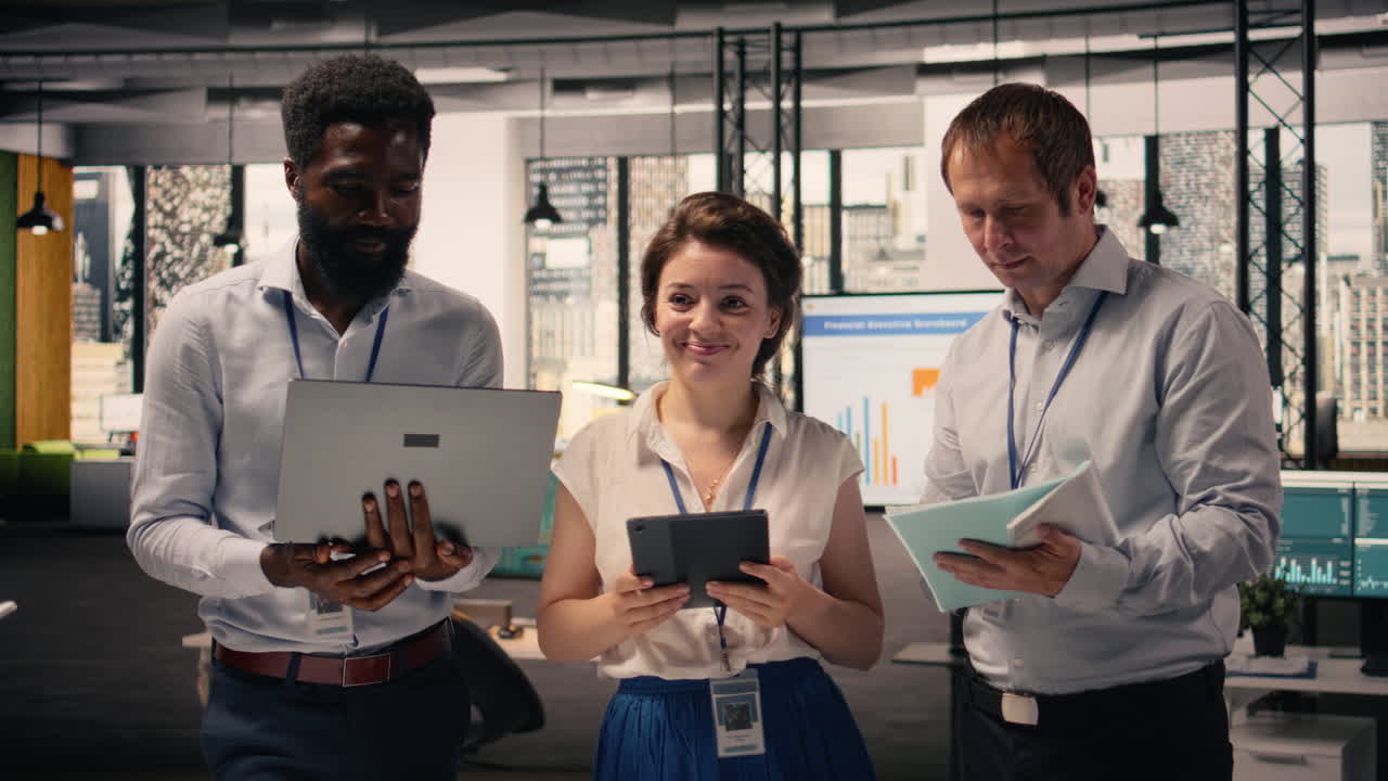 Portrait of multinational team collaborating on charts and business intelligence