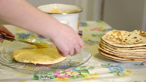 cooking. a woman is preparing a puff cake. custard