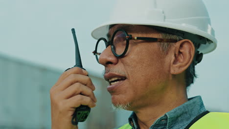 construction worker communicating via radio
