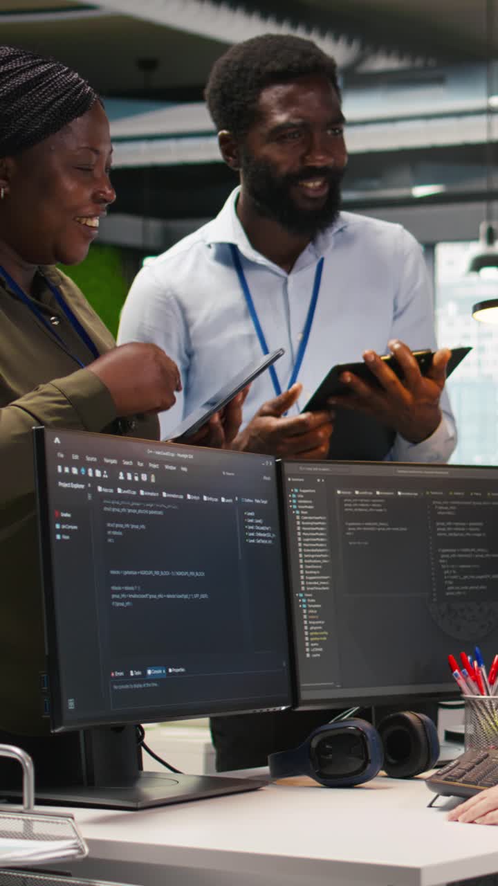 Vertical video Startup newcomer making friends in office, learning how to use machine learning