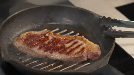 cooking delicious beef steak