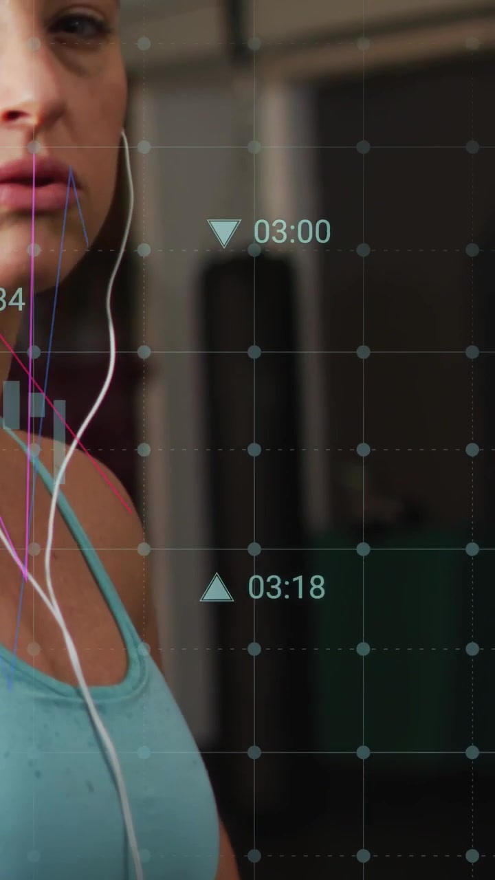 Vertical video: Woman adjusting as camera rising HUD charts forming right tracking fitness