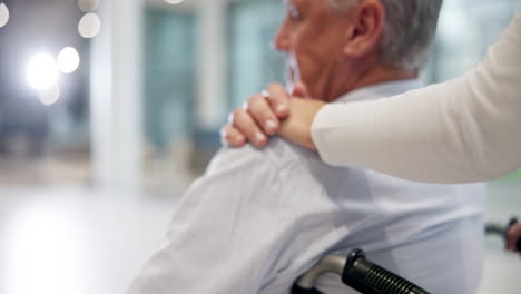 Hands-of-nurse,-support-or-old-man-in-wheelchair