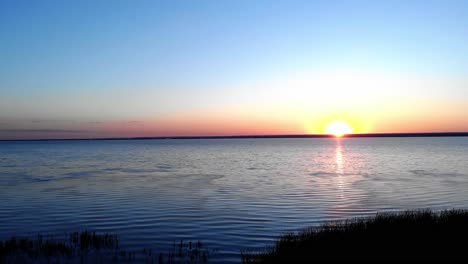 scenic lake at sunrise - aerial sideways