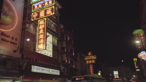 neon sign above of yaowarat street, bangkok, thailand