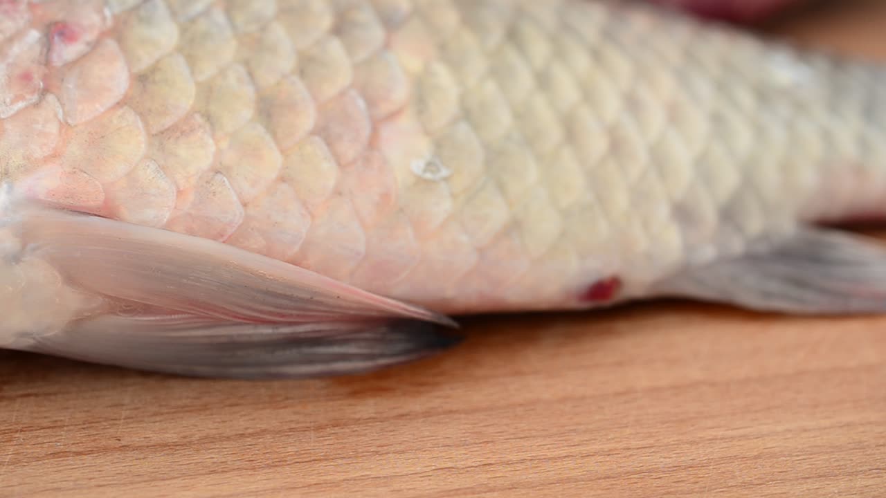 Crucians on a chopping board. Fresh fish