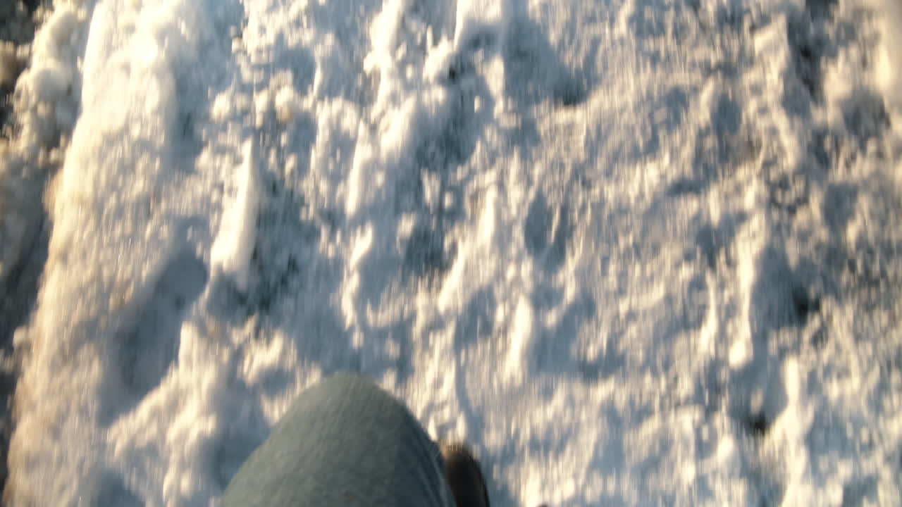 Male walking in snow pov