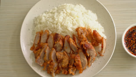 fried pork topped on rice with spicy dipping sauce