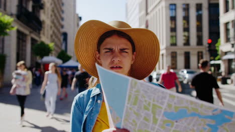 woman looking at a map in a city