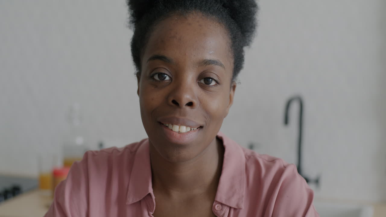 Portrait of a Smiling Woman in a Kitchen