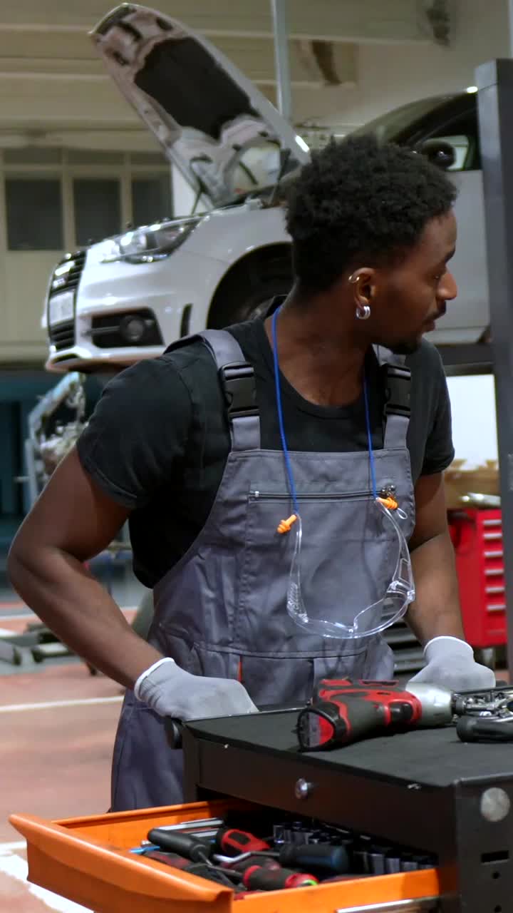 Mechanic working on a car in a repair shop