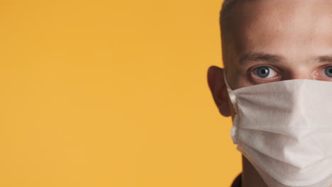 Young-man-wearing-white-face-mask