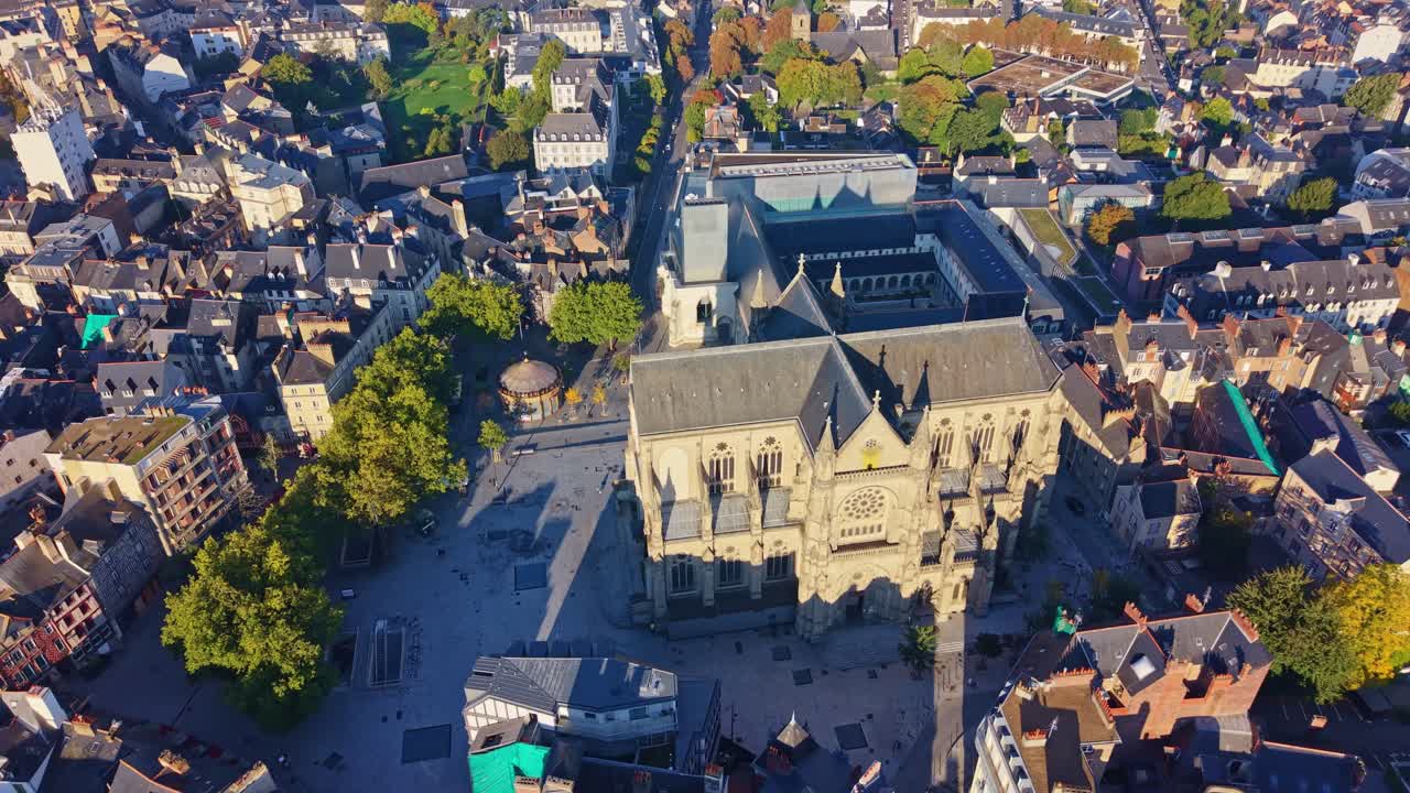 Place Saint-Anne and Saint-Aubin Basilica in Rennes at sunrise, France. Aerial drone forward tilt down