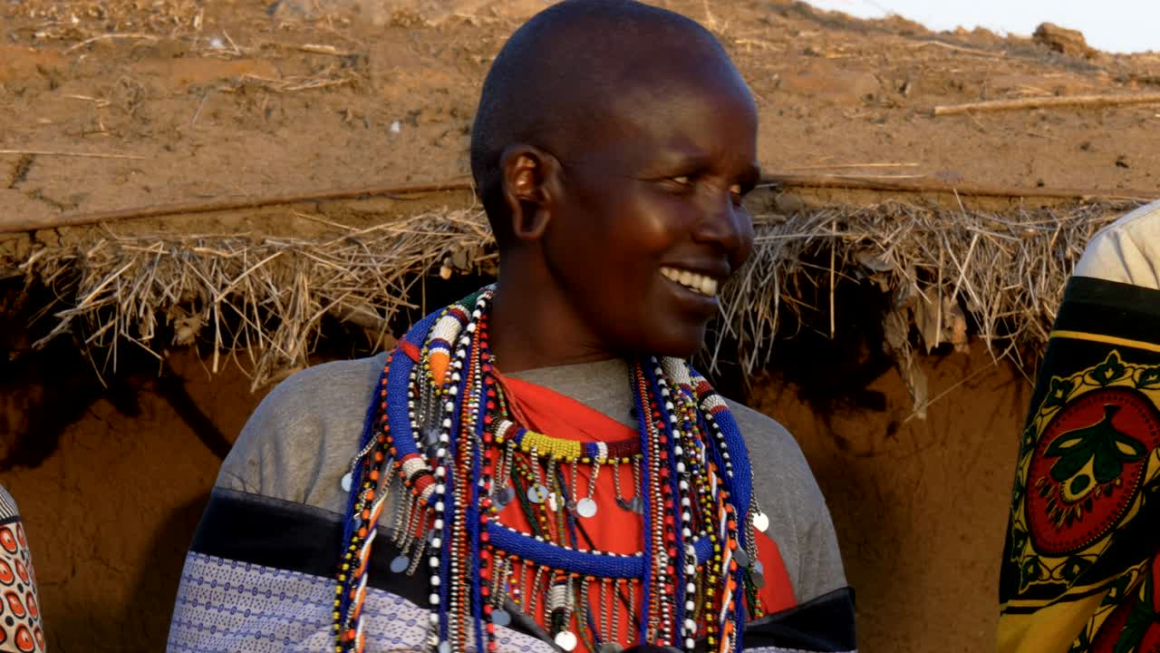 close up of a maasai woman singing in a village near masai mara
