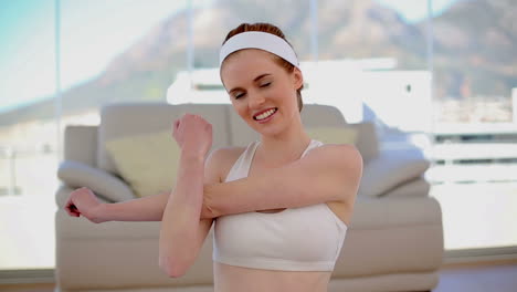 content smiling woman stretching her arms