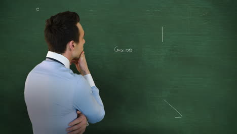 back view of man thinking in front of moving maths calculations on chalkboard 4k