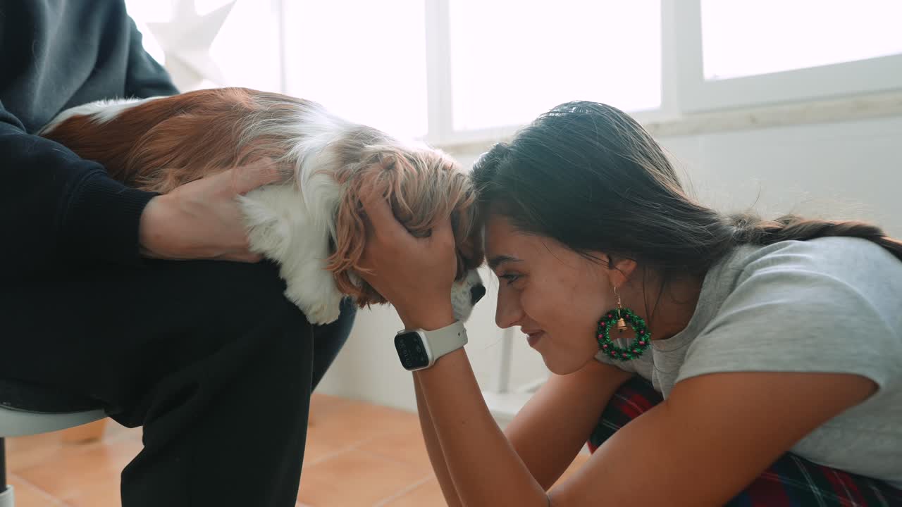 A woman interacting with a dog
