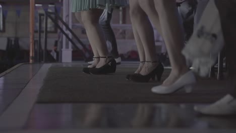 close up shot of female and male dancer dancing folklore on stage - real time low angle 4k