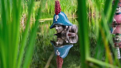 Napoleon-Bonaparte-statue-getting-through-swamp-terrain,-time-lapse-view