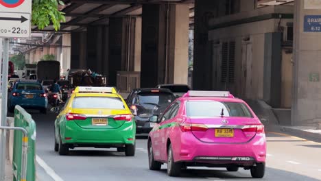 vehicles and motorbikes on a busy road