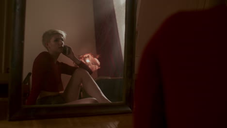 woman talking on phone in a bedroom