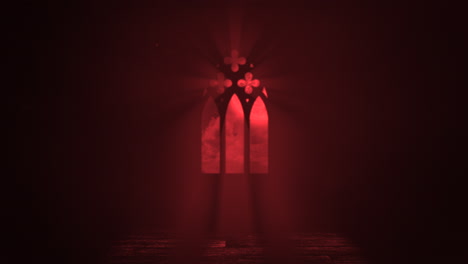 Window-of-old-castle-with-red-light-and-crosses-in-night
