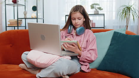 online education at laptop of child girl at home virtual class remote lesson distance studying