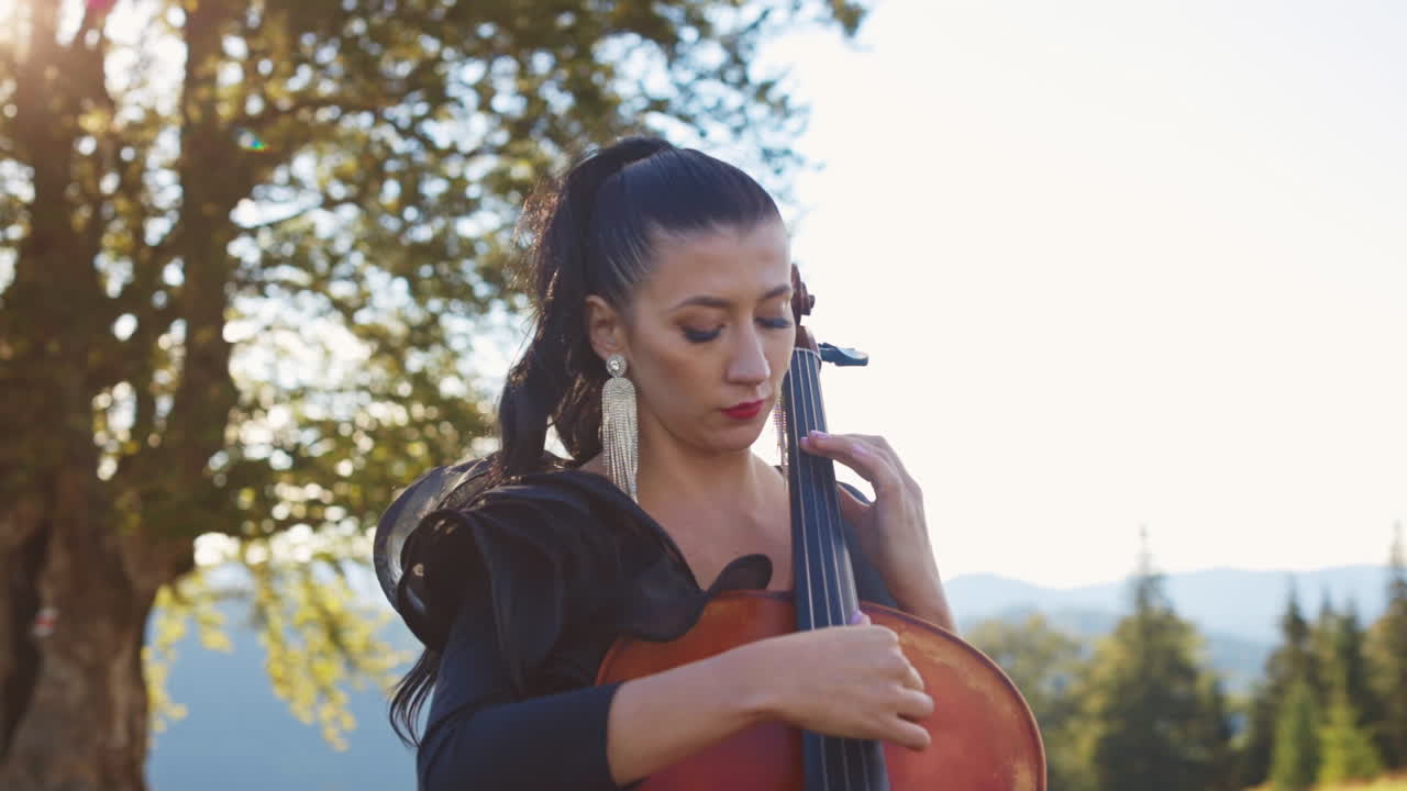 Woman Playing Cello in Nature