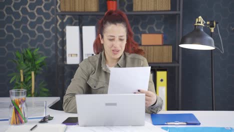 business woman rejoicing at positive paperwork results.