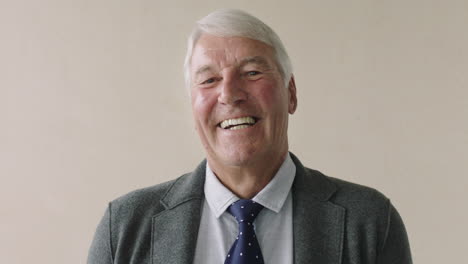 portrait-of-confident-elderly-businessman-laughing