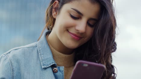 Handheld-view-of-young-woman-who-use-mobile-phone