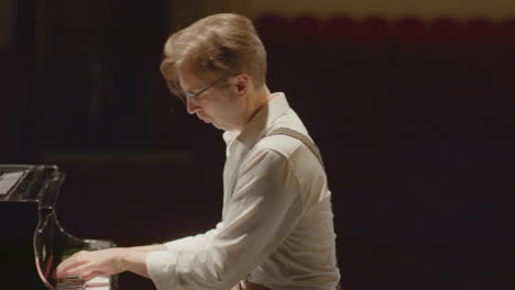 pianist practicing playing piano before recital