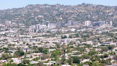 extremely hot day in los angeles ca usa, drone shot of heatwave mist above sunset hills and buildings