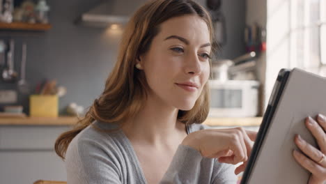 Happy-beautiful-woman-using-digital-tablet-at-home