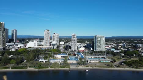 revealing aerial view of the gold coast suburb southport looking from the broadwater showing the high-rise apartment buildings and aquatic centre