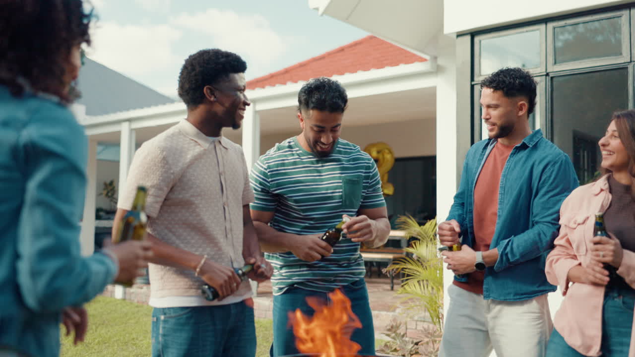 Friends enjoying a barbecue with beer in the backyard