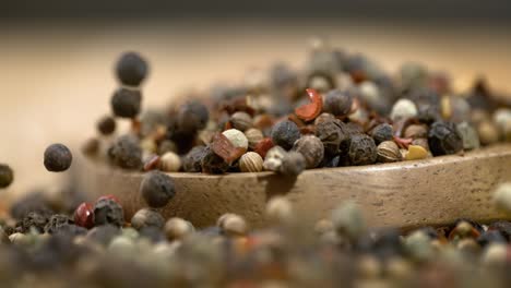 Mixed-peppercorns-in-a-super-slow-motion.-Dry-mix-peppercorns-close-up.