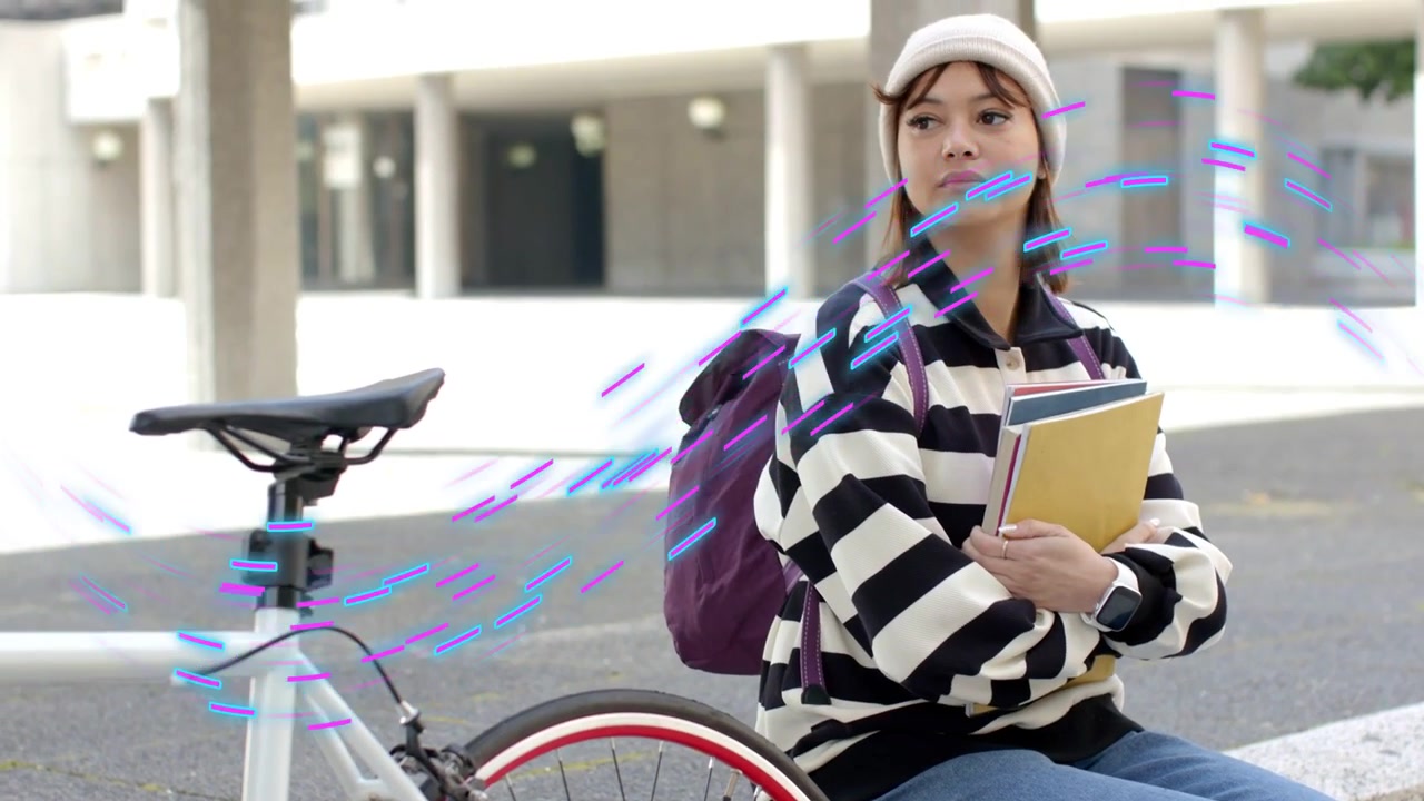 Student sitting by bike with books waiting as camera tightening showing purple streaks across her