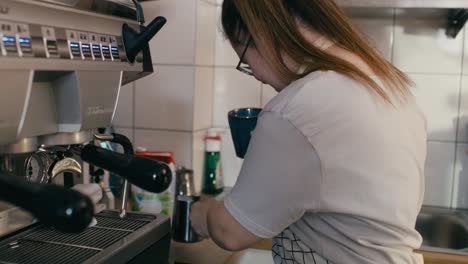 down syndrome girl making coffee as a worker in the cafe