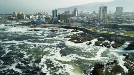 a coastal road shot in a small port at the pacific ocean of chile