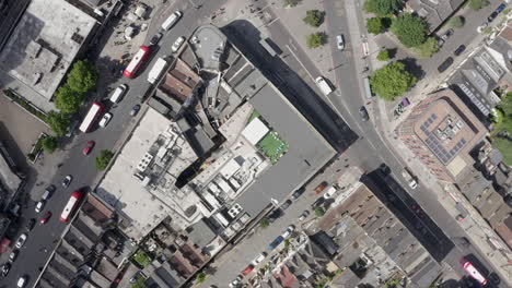 Aerial-spins-looking-straight-down-onto-building-roof-top-in-London-UK