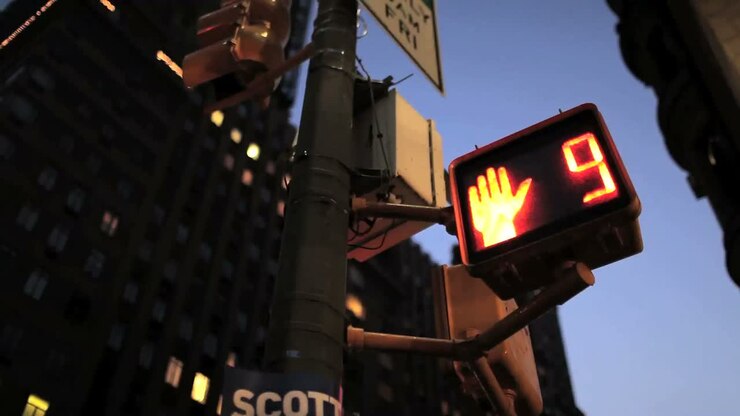 Pedestrian crossing countdown sign at an intersection in New York City