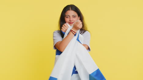 Indian-woman-holds-Israel-national-flag-showing-protest-against-war,-hoping-for-success-and-win