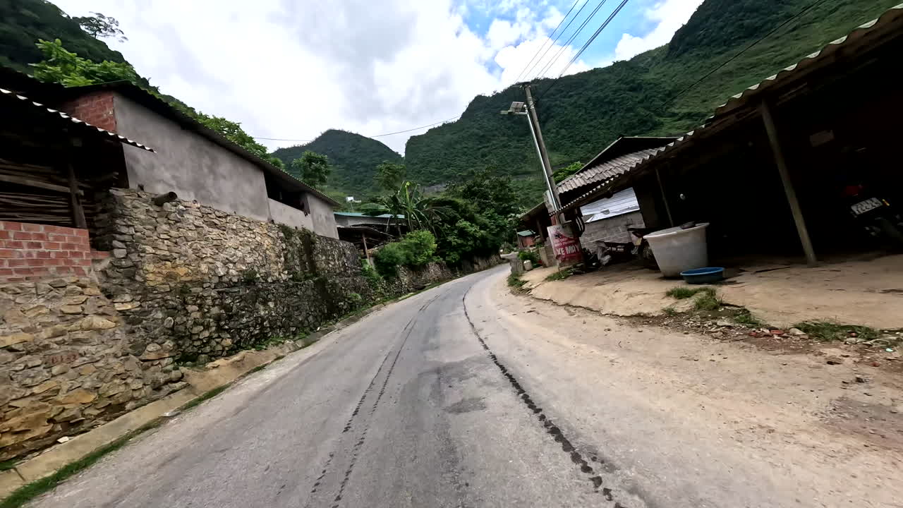 Houses Along The Route Of Motorcycle Loop In Vietnam, Ha Giang Province. POV Shot