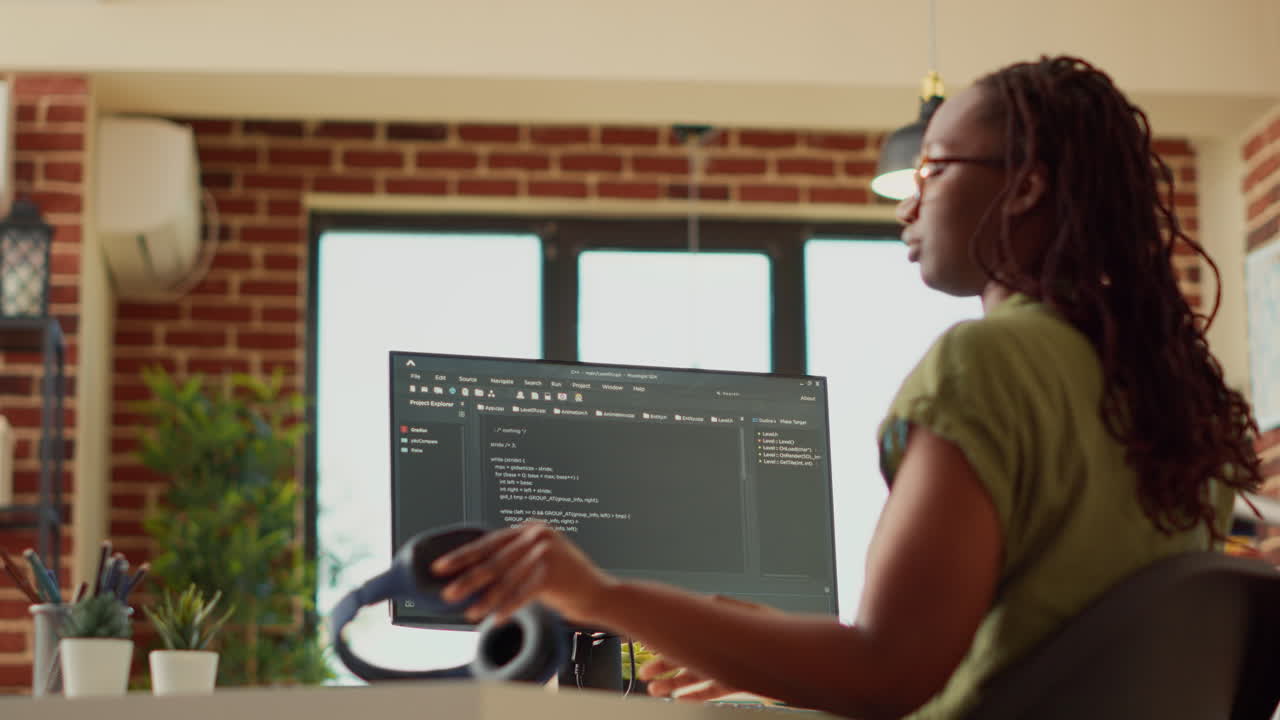 Female programmer using code to develop online app