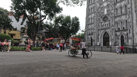 cyclists and pedestrians around historic cathedral